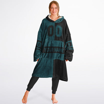 Midnight green and black halftime snug hoodie featuring a symmetrical split design for a dynamic game-day look.
