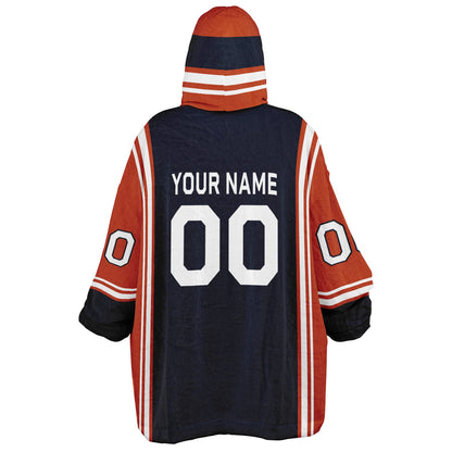 Navy, orange, and white bold snug hoodie with triple color blocking and a sporty aesthetic.