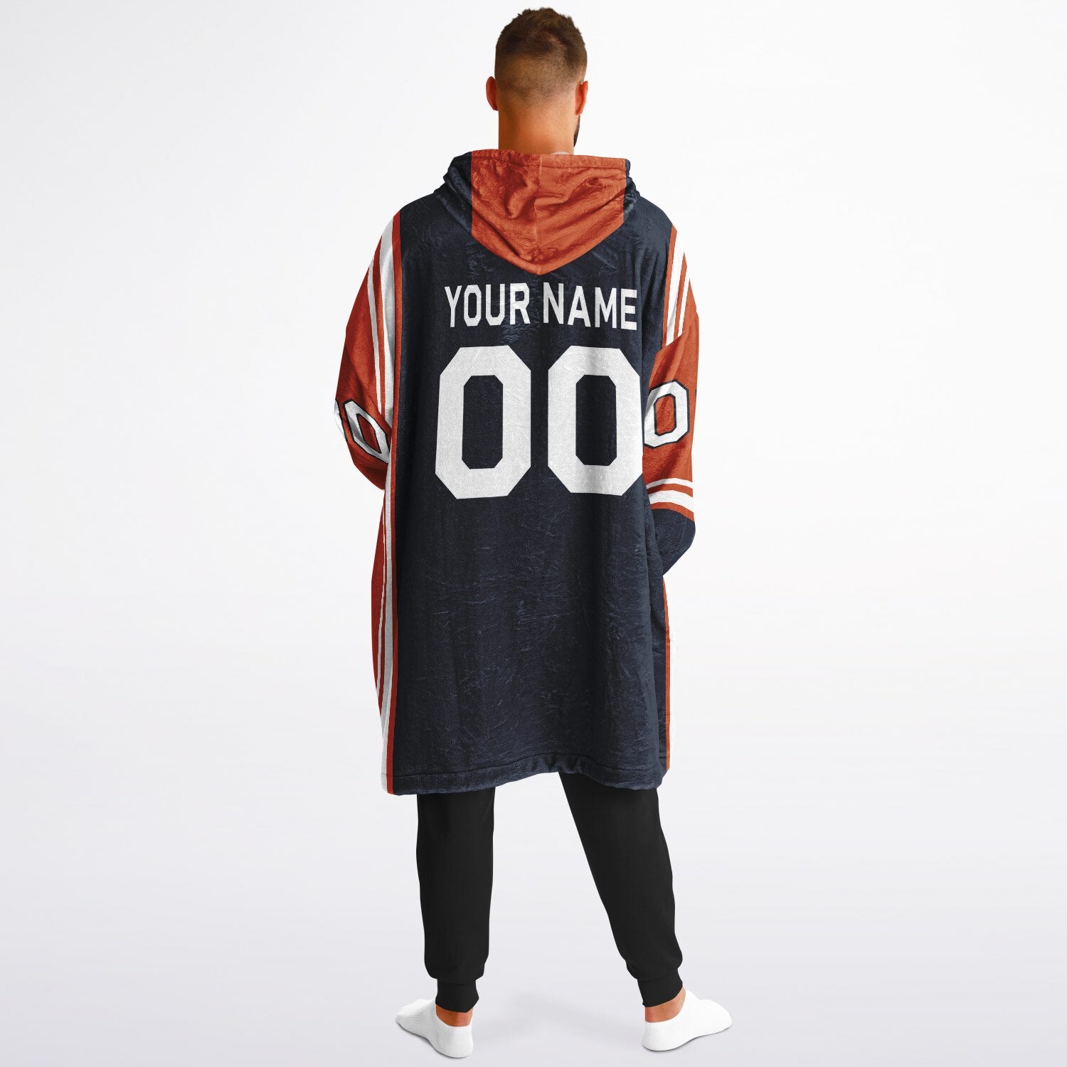 Navy, orange, and white bold snug hoodie with triple color blocking and a sporty aesthetic.