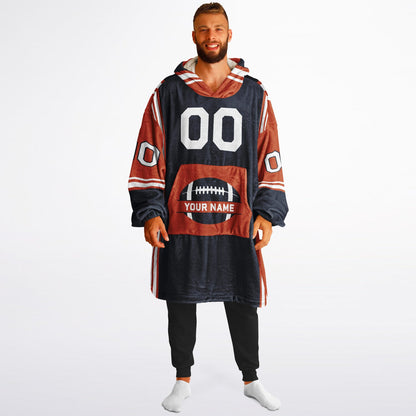 Navy, orange, and white bold snug hoodie with triple color blocking and a sporty aesthetic.