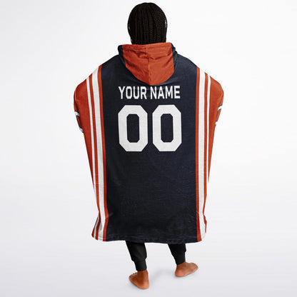 Navy, orange, and white bold snug hoodie with triple color blocking and a sporty aesthetic.