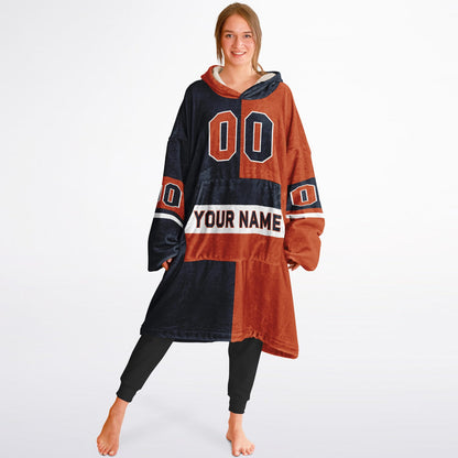 Navy, orange, and white halftime snug hoodie with three-tone split design and cozy fleece texture.
