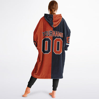 Navy, orange, and white halftime snug hoodie with three-tone split design and cozy fleece texture.