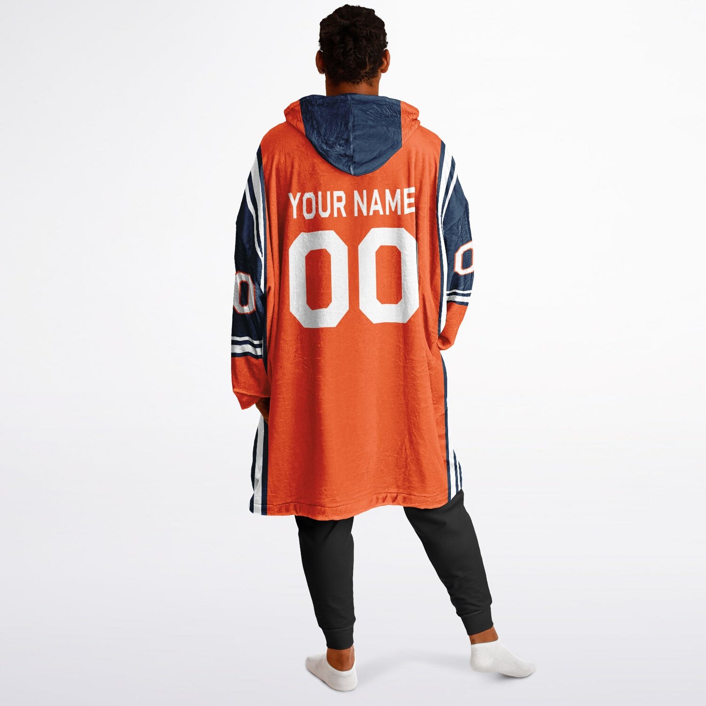 Orange, navy, and white bold snug hoodie with triple color blocking and a sporty aesthetic.