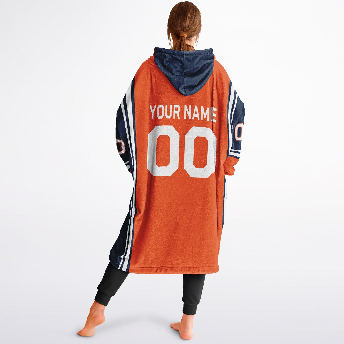 Orange, navy, and white bold snug hoodie with triple color blocking and a sporty aesthetic.