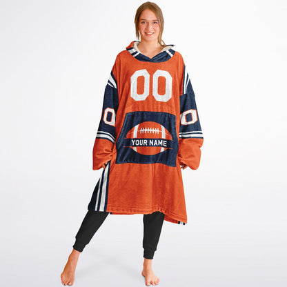 Orange, navy, and white bold snug hoodie with triple color blocking and a sporty aesthetic.