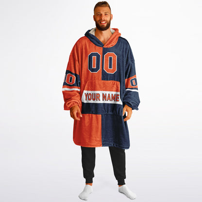 Orange, navy, and white halftime snug hoodie with three-tone split design and cozy fleece texture.