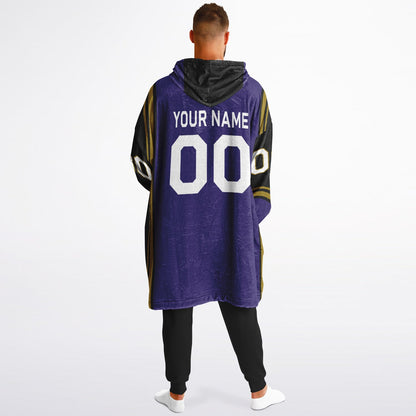 Purple, black, metallic gold bold snug hoodie with triple color blocking and a sporty aesthetic.
