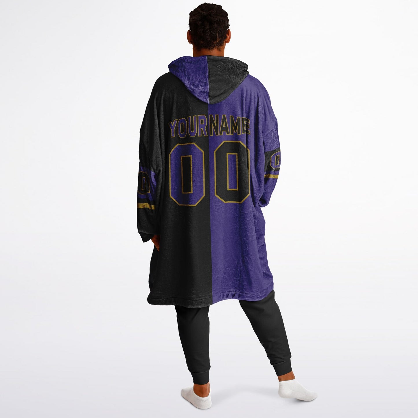 Purple, black, and metallic gold halftime snug hoodie with three-tone split design and cozy fleece texture.