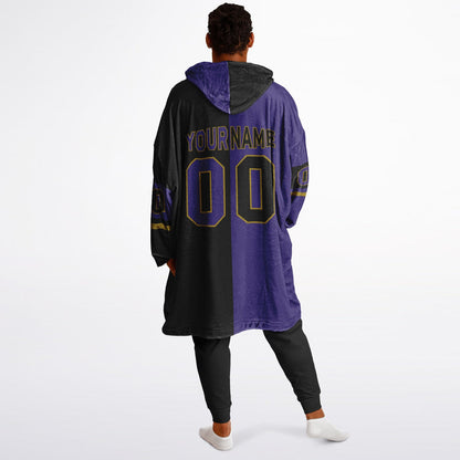 Purple, black, and metallic gold halftime snug hoodie with three-tone split design and cozy fleece texture.