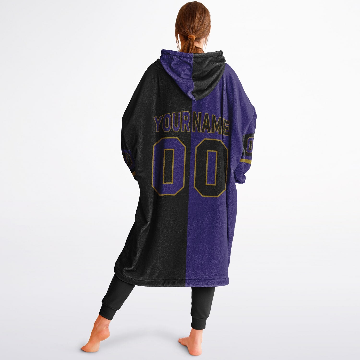 Purple, black, and metallic gold halftime snug hoodie with three-tone split design and cozy fleece texture.