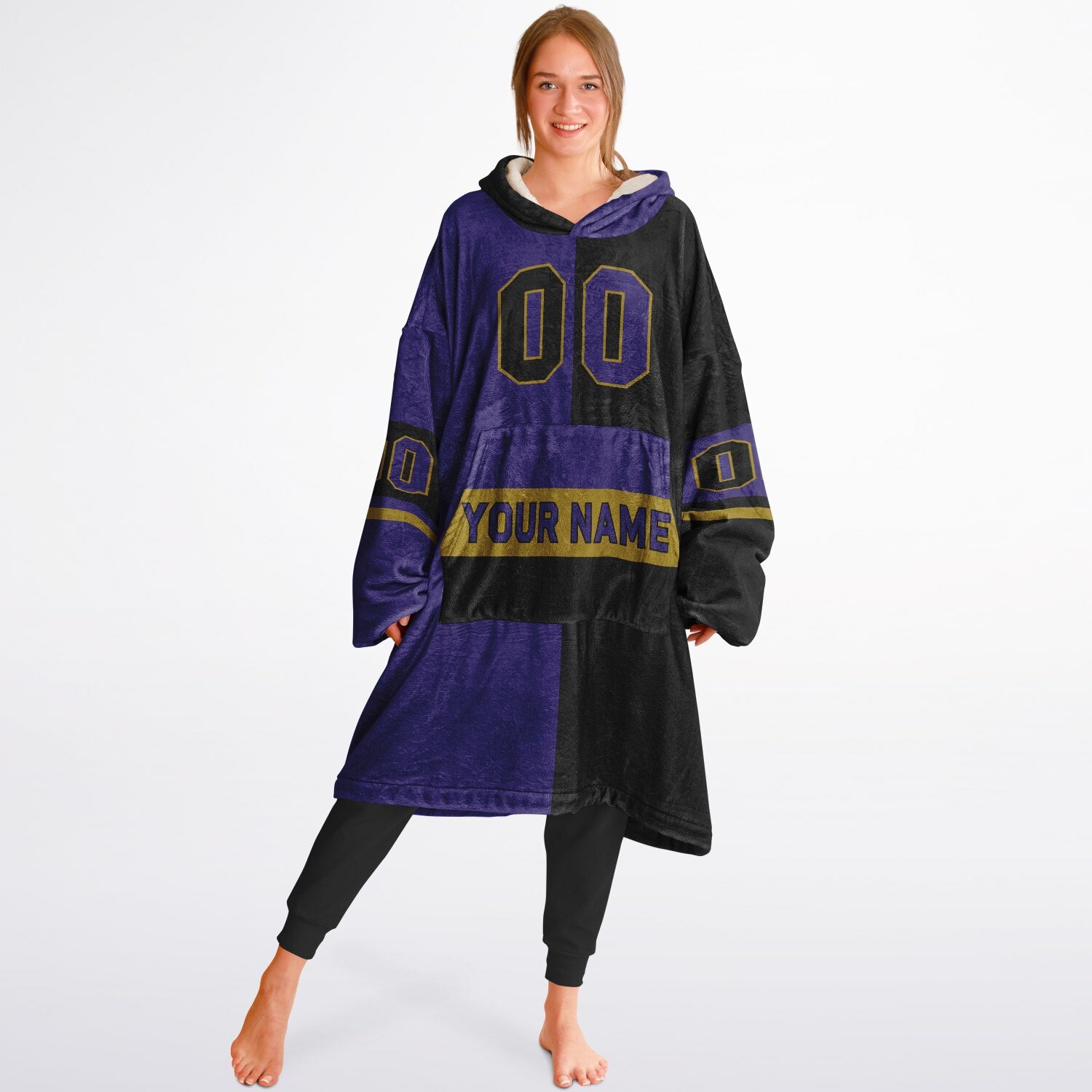Purple, black, and metallic gold halftime snug hoodie with three-tone split design and cozy fleece texture.