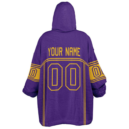 Purple and gold lineup snug hoodie featuring sleek line-art details and minimalist team-inspired design.