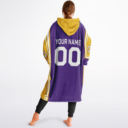 Purple, gold, and white bold snug hoodie with triple color blocking and a sporty aesthetic.