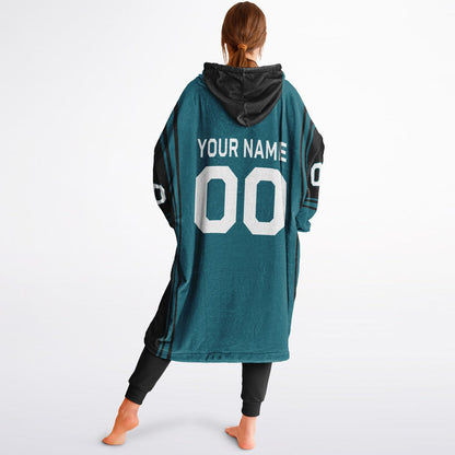 Teal and black bold snug hoodie with modern color-block design and soft loungewear fit.