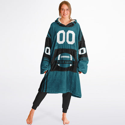 Teal and black bold snug hoodie with modern color-block design and soft loungewear fit.