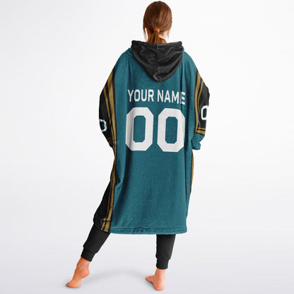 Teal, black, and gold bold snug hoodie with triple color blocking and a sporty aesthetic.