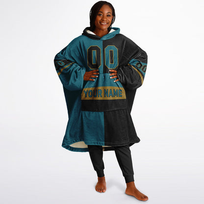Teal, black, and gold halftime snug hoodie with three-tone split design and cozy fleece texture.