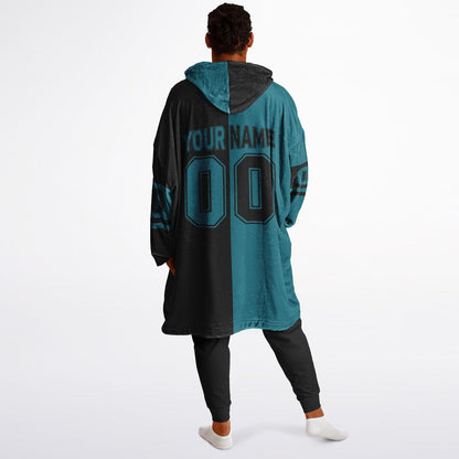 Teal and black halftime snug hoodie featuring a symmetrical split design for a dynamic game-day look.