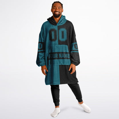 Teal and black halftime snug hoodie featuring a symmetrical split design for a dynamic game-day look.